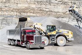 Naceville Quarry: A Komatsu WA-500 loads a customer truck with aggregate.