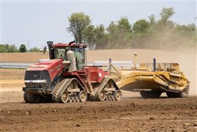 Landis C. Deck & Sons Division: A Case IH 540 QuadTrac and KTec 1228 pan head back to the cut to load again.