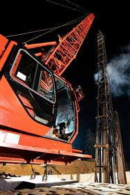 Structures Division: A Structures Division crew utilizes a Manitowoc crane and ICE hammer to install beams along the PA Turnpike. 