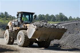 Naceville Quarry: A Caterpillar 982M moves aggregate to stockpiles.