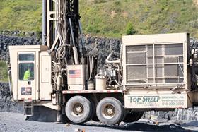 Drilling Division: A wheeled drill rig works at Naceville Quarry. 