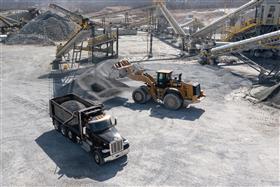 Penn/MD Quarry: A Caterpillar 982M loads a customer truck with aggregate from the plant. 
