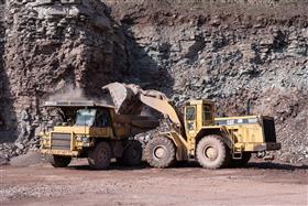 Pikes Creek Quarry & Asphalt: A Caterpillar 988F loads a Caterpillar 769D with shot rock. 