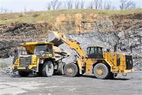 Plumstead Quarry: A Caterpillar 988K loads a Komatsu HD465 with shot rock.