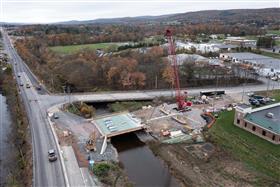 Structures Division: A Structures Division team utilizes a Manitowoc crane to place precast concrete beams on SR443. 