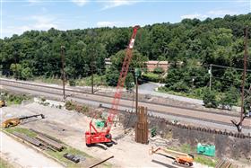 Structures Division: A Structures Division crew drives sheet along the Amtrak mainline in Coatesville, PA. 