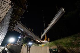 Structures Division: A Structures Division team sets bridge beams on the new Vera Cruz Road bridge. 