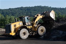 Warren Asphalt: A Caterpillar 966M stockpiles recycled asphalt material.