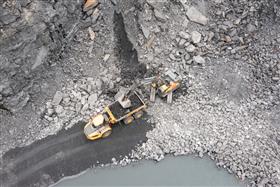 Wilkes-Barre Materials: A overhead view of the Volvo EC750E loading a Volvo A60H with shot rock.